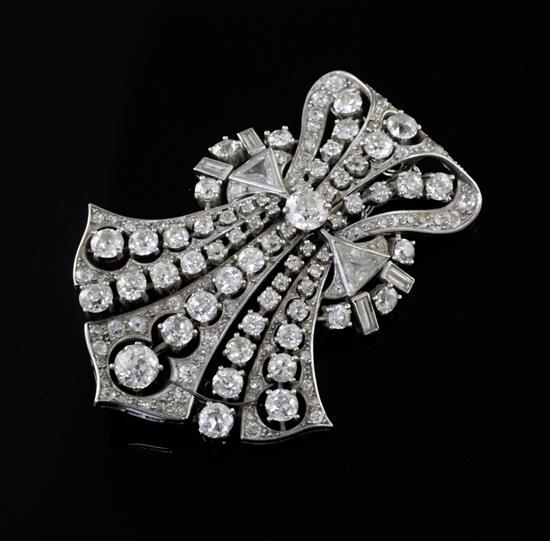 An Art Deco style diamond and platinum openwork claw, collet and pave-set fan shaped brooch, 52mm.